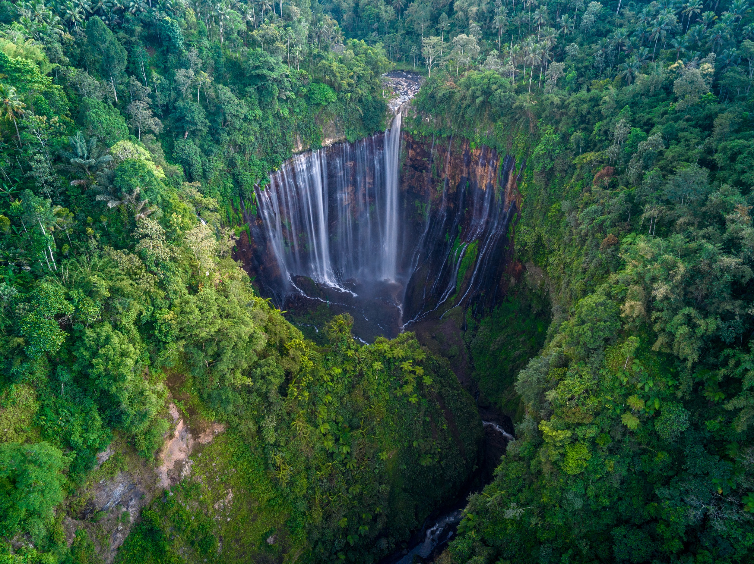Aerial Top View From Above Of Tumpak Sewu Waterfall In Malang, East Java, Indonesia